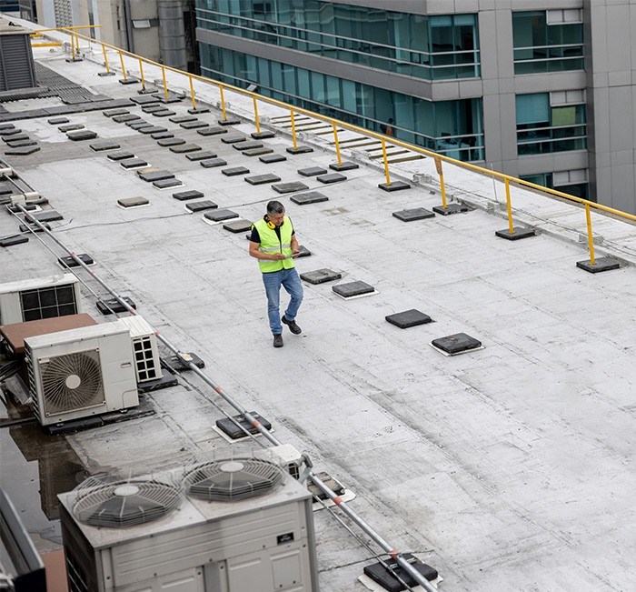 our commercial roofer completing roof maintenance in Euclid