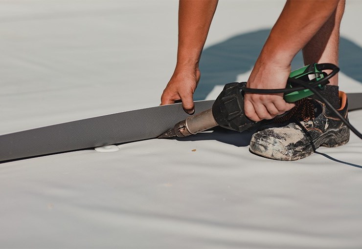 our roofer completing a commercial roof repair in euclid