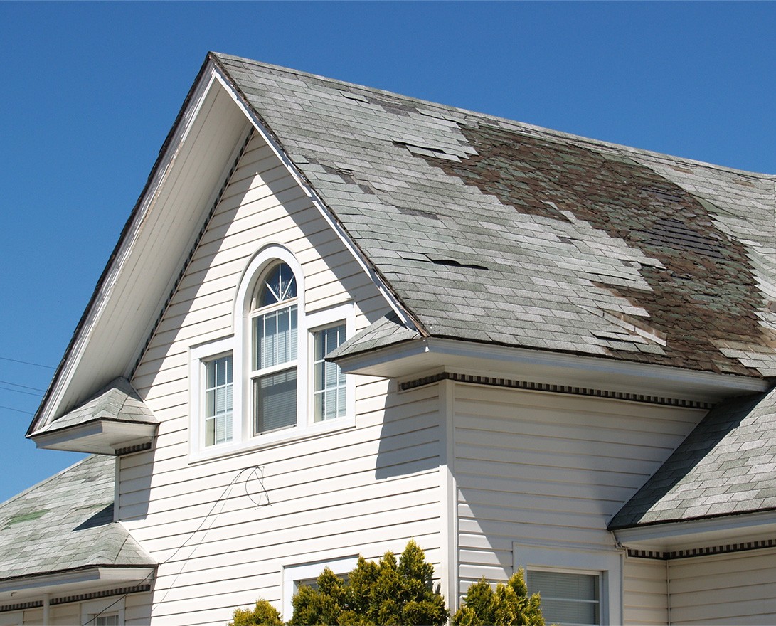 home showing signs of needing roof repair in euclid